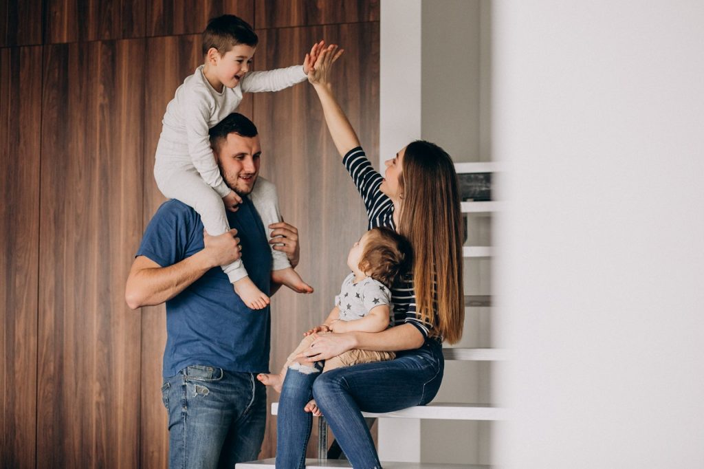 young family with their little son home having fun - Bizmedia.kz