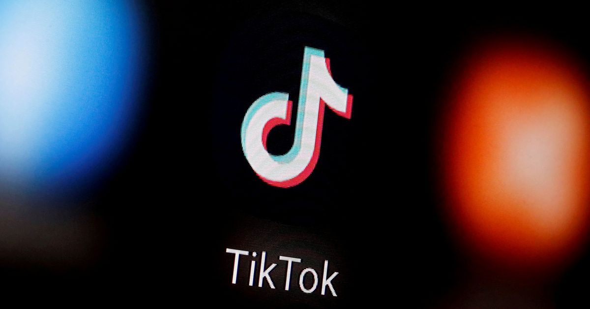 A TikTok logo is displayed on a smartphone in this illustration