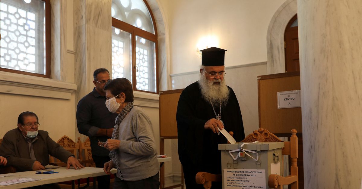 Bishop Georgios of Paphos casts his ballot at a polling station in Apostle Varnavas Cathedral during the election process for a new Archbishop of Cyprus, to lead the island