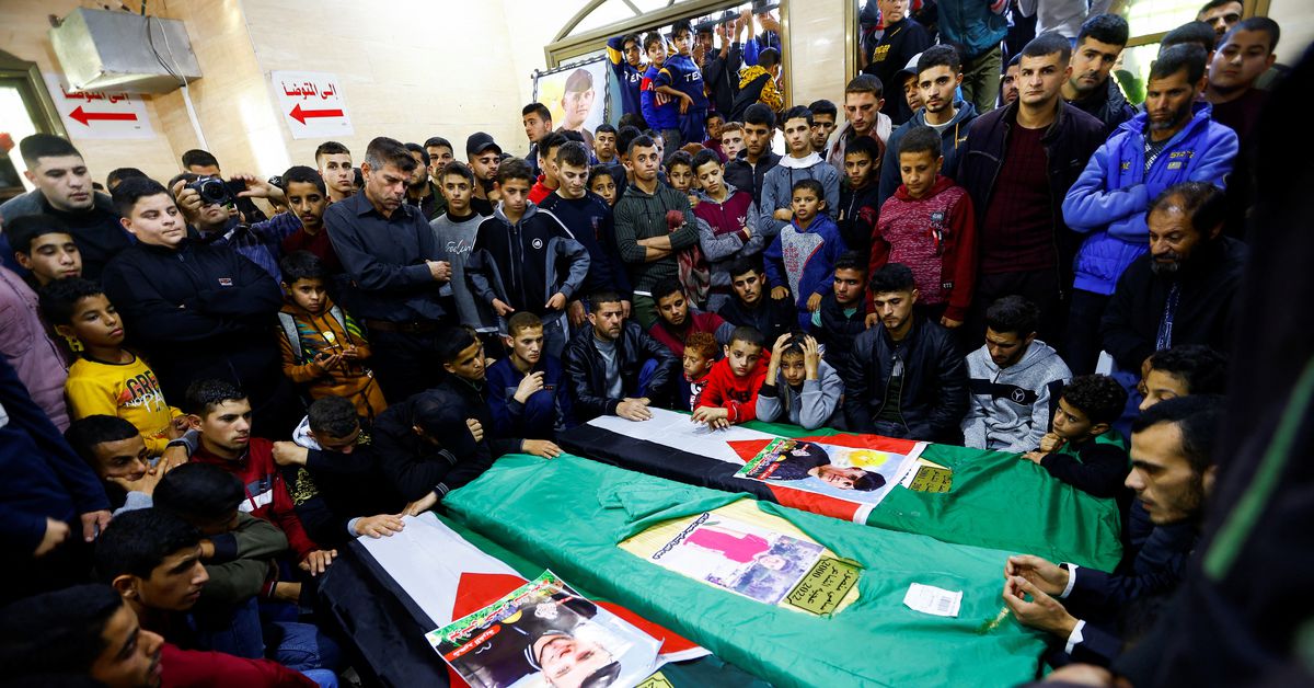 Palestinians attend the funeral of 8 people, who died when a ship carrying migrants drowned offshore Tunisia in Rafah