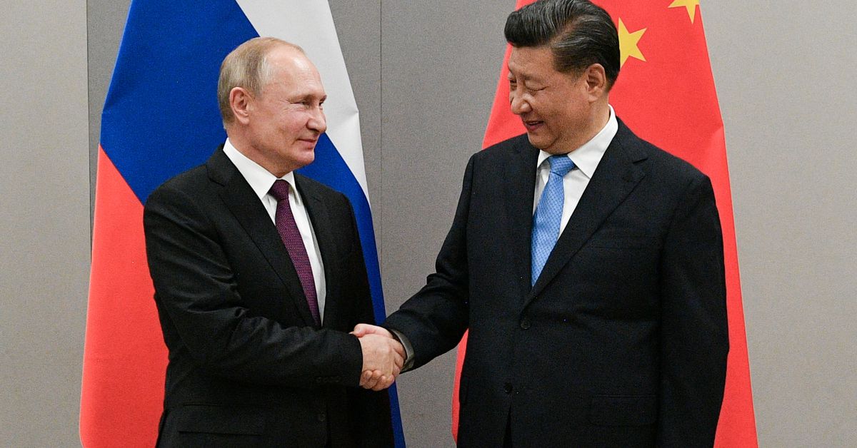 Russian President Putin meets with Chinese President Xi during their meeting on the sideline of the BRICS summit in Brasilia